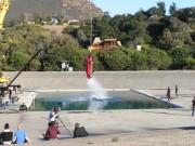 photo of stunt crew and red car in car/water/bungee stunt